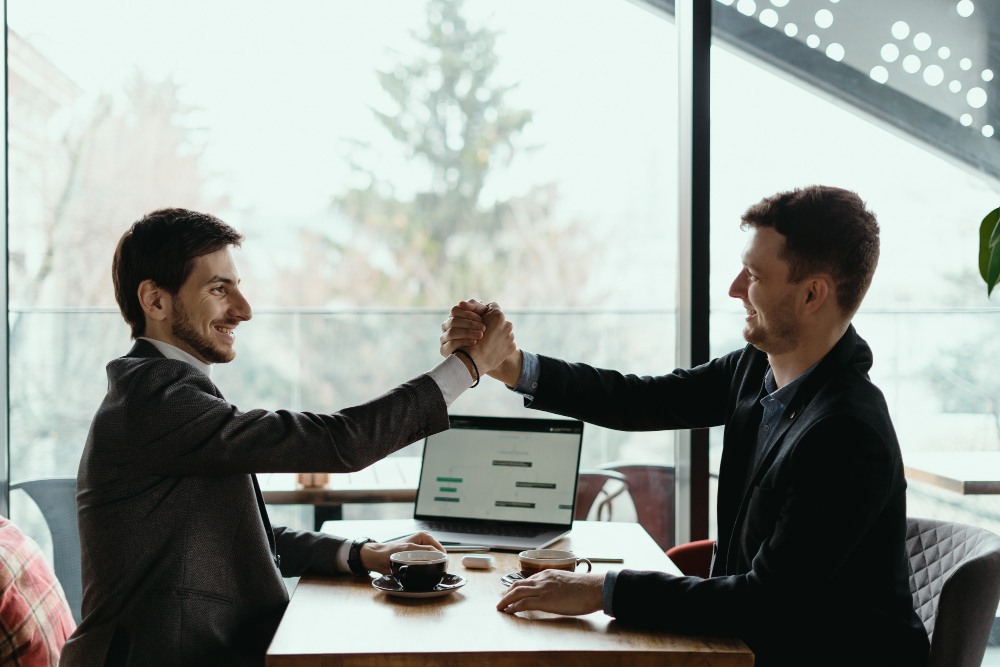 two-business-men-celebrating-deal